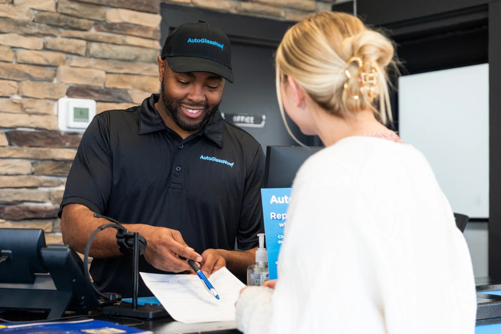 AGN employee helping customer