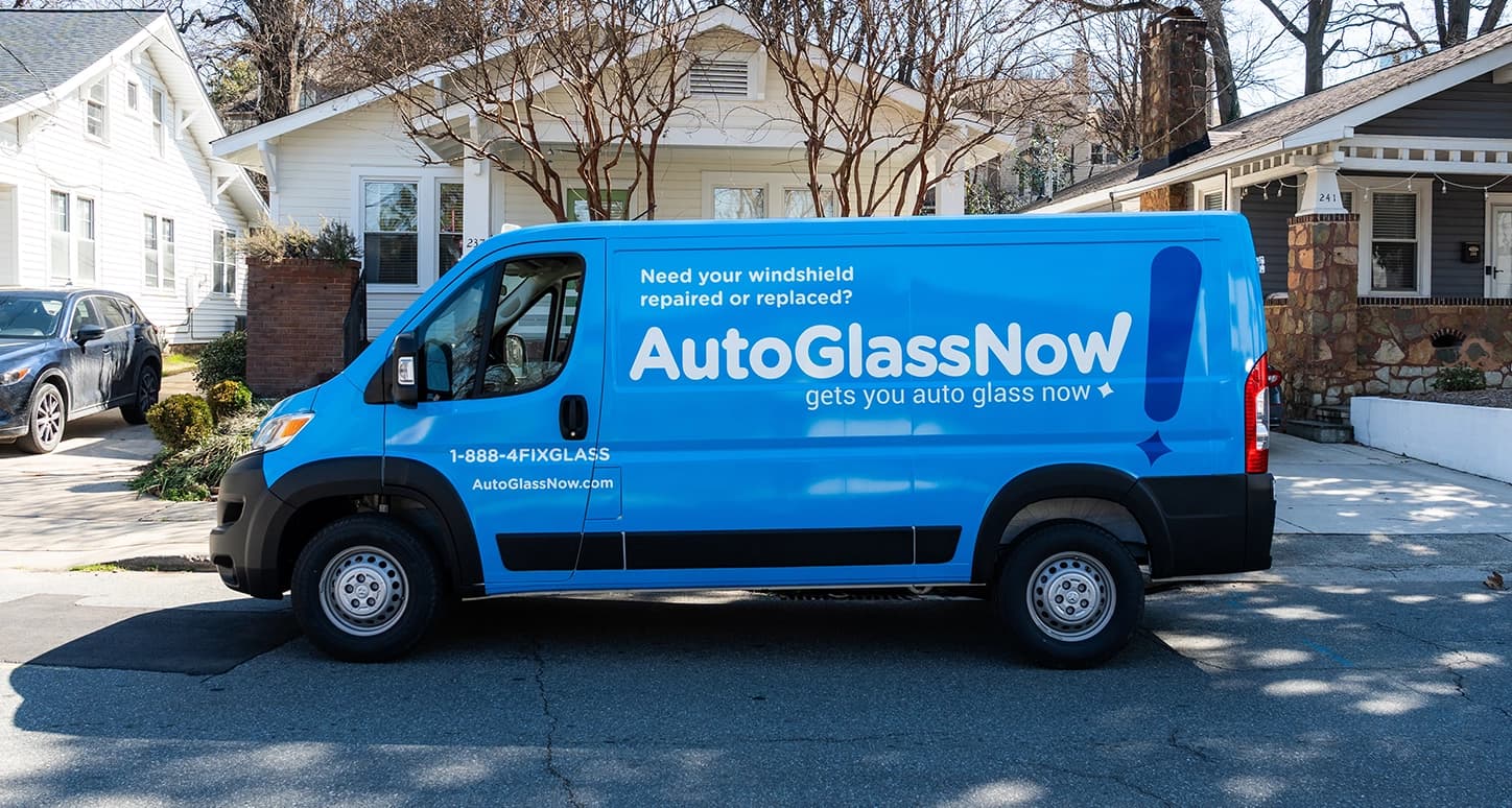 Mobile repair van parked in a neighborhood.